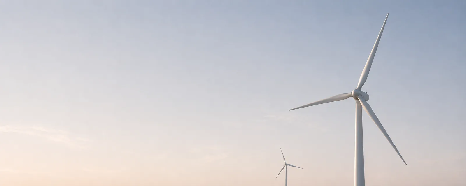 Wind turbines under a pale sky