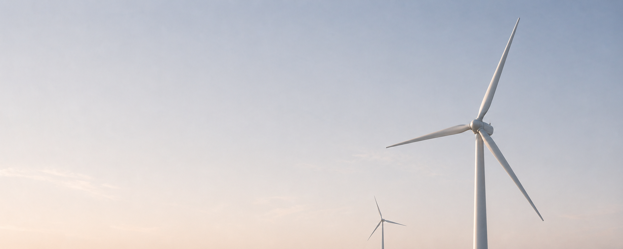 Wind turbines under a pale sky