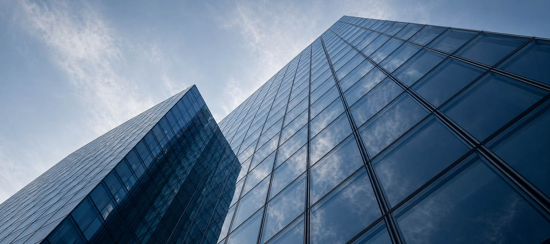 Abstract glass facade looking upward